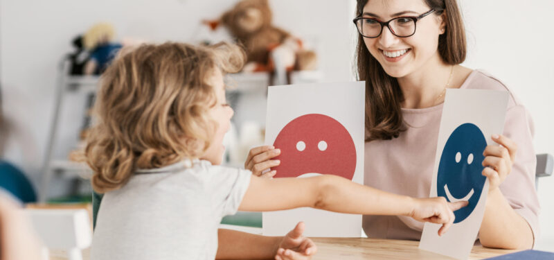 Emotion emoticons used by a psychologist during a therapy session with a child with an autism spectrum disorder.